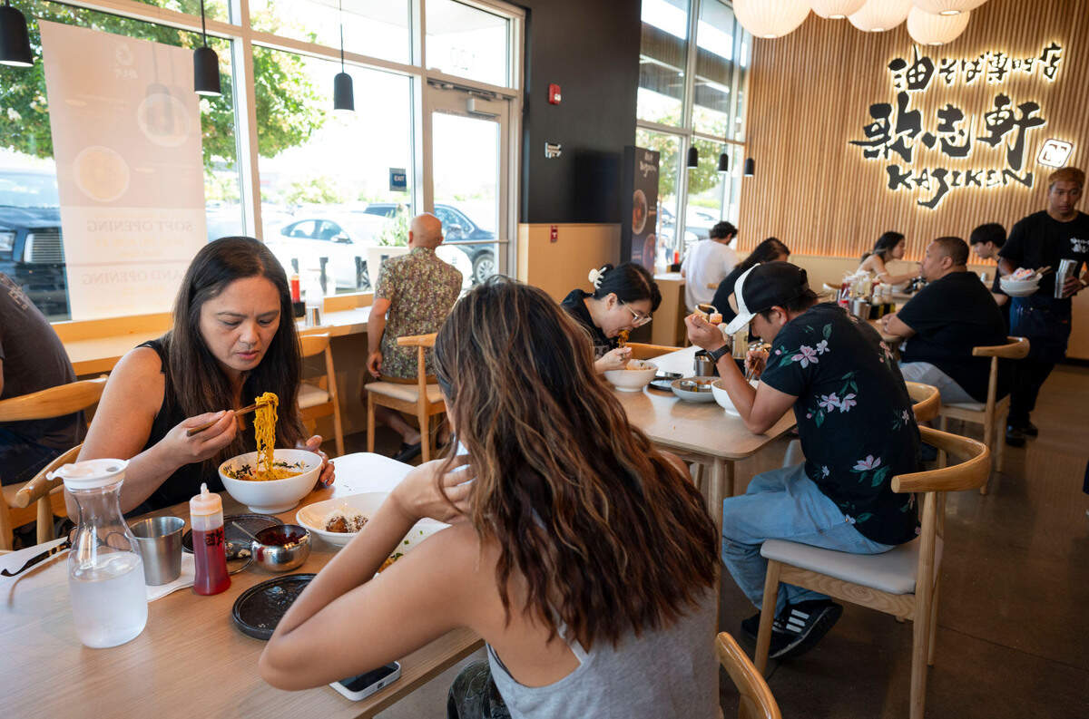 Mother and daughter Ernalou Estacio, left, and Ellyana Estacio, have lunch on opening day at Kajiken in Elk Grove on Thursday. The Japan-based chain is the Sacramento region’s first restaurant specializing in abura soba, Japanese noodles similar to brothless ramen.
