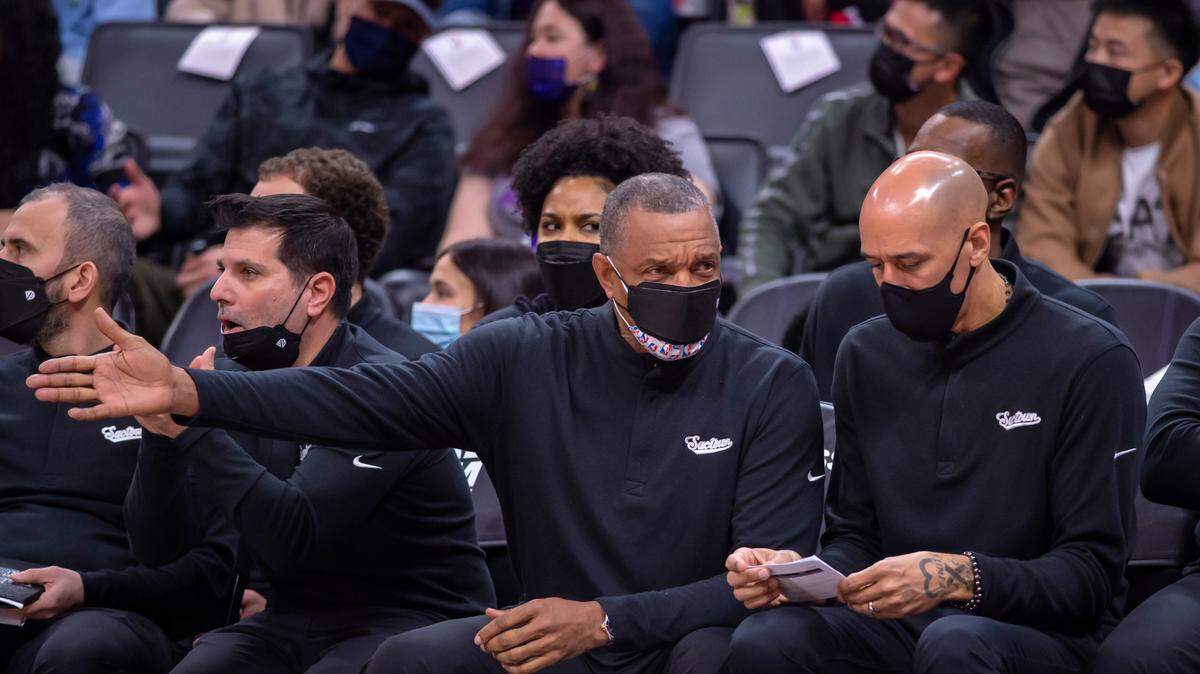 Sacramento Kings interim head coach Alvin Gentry, center, talks with assistant coach Doug Christie during the second quarter on Friday, Dec. 31, 2021 during an NBA basketball game at the Golden 1 Center in Sacramento.