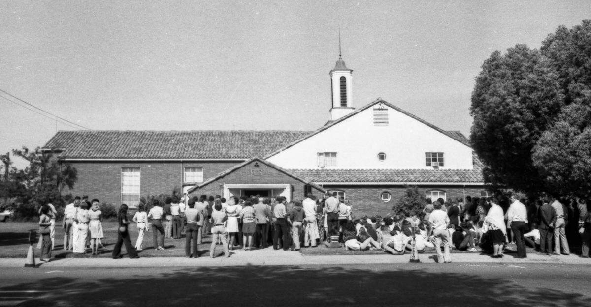 Students and families grieve outside the Yuba City Ward of the Church of Jesus Christ of Latter-day Saints on May 24, 1976, at a service for five of the 29 victims of the Yuba City High School choir bus crash near Martinez days before. 