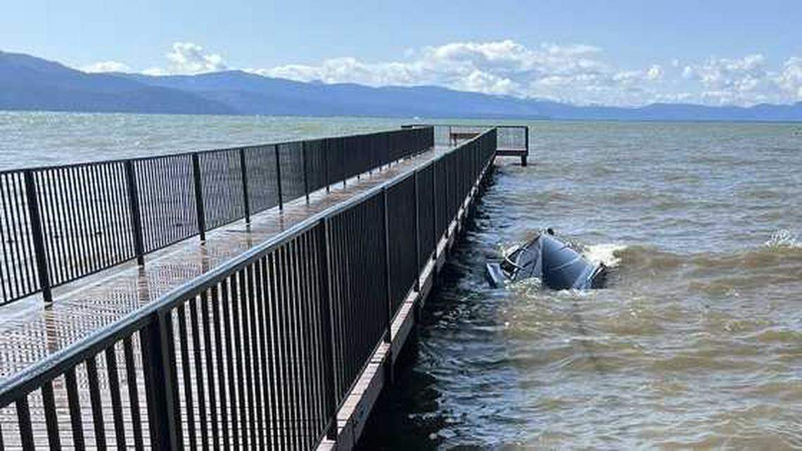 The Johnston family’s Mastercraft boat rests capsized against a pier in Tahoe Keys Marina on June 21.
