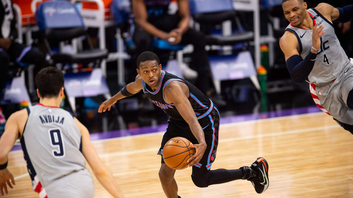 Sacramento Kings guard De’Aaron Fox (5) recovers a turnover and dribbles downcourt against the Washington Wizards during the fourth period of the NBA game Wednesday, April 14, 2021, at Golden 1 Center in downtown Sacramento. The Kings fell to the Wizards, 123-111.