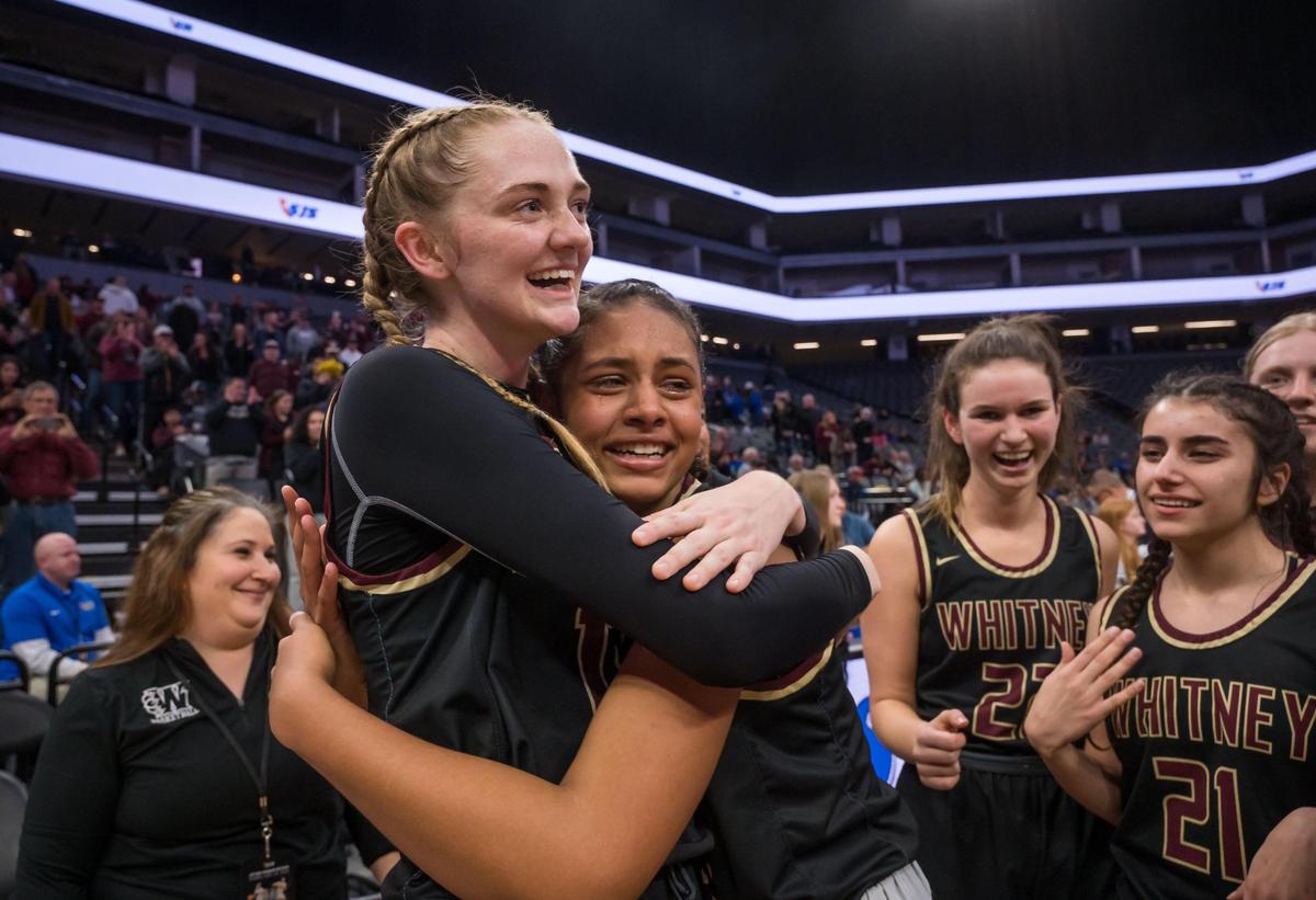 Whitney Wildcats forward Harper Peterson, left, is embraced by a tearful teammate Za’Raya Harris, after their comeback win over the Christian Brothers Falcons at the Sac-Joaquin Section Division II high school girls basketball final game in February at Golden 1 Center.