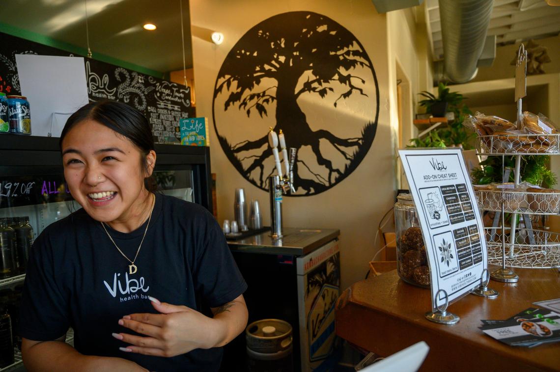Gemina Mae, manager of Vibe Health Bar, says she is vegan and invites others to come eat some of the vegan selections at the restaurant, Monday Dec. 30, 2019 in the Oak Park neighborhood of Sacramento.