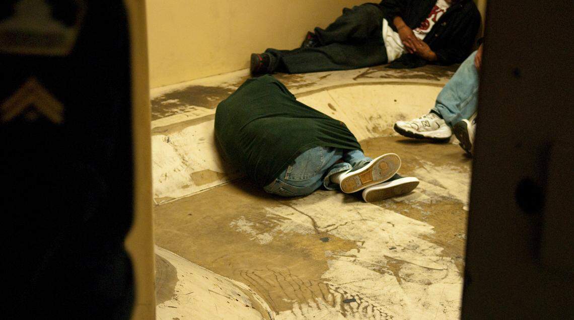 Inmates sober up inside the sobering cell at the Sacramento Main Jail Thursday in 2009. Inmates are placed in the “drunk tank” until they are sober enough to be released or transferred to a different area of the jail.