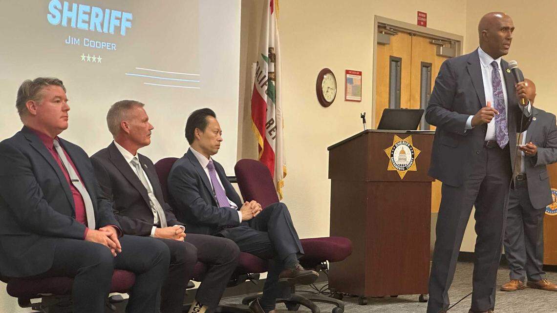 Sacramento County law enforcement leaders, including Sheriff Jim Cooper, right, and District Attorney Thien Ho, center, talk at a town hall in south Sacramento on June 4, 2025, to criticize the state’s mental health diversion law.