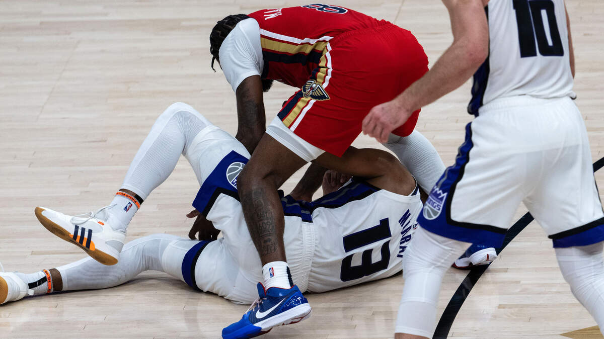 Sacramento Kings forward Keegan Murray (13) loses the ball to New Orleans Pelicans forward Naji Marshall (8) during an NBA play-in game at Smoothie King Center in New Orleans on Friday, April 19, 2024.
