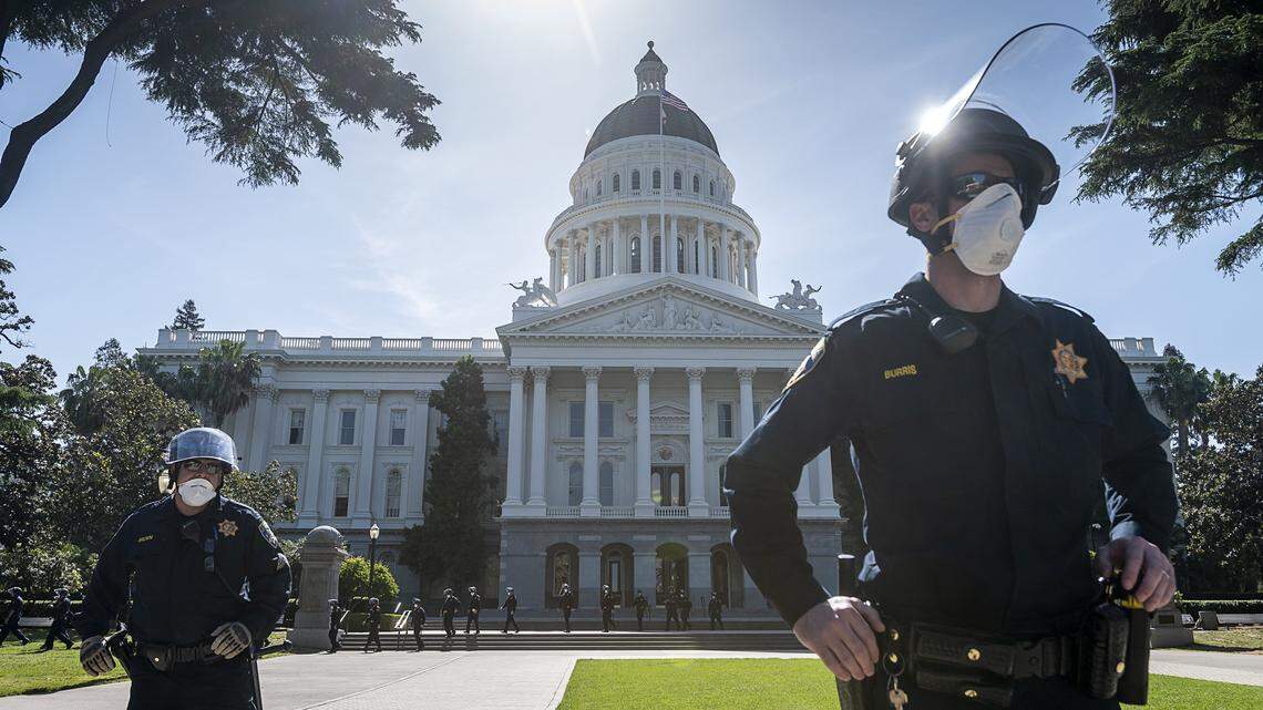 California Highway Patrol officers guard the state Capitol grounds during a protest on Thursday, May 7, 2020 in Sacramento during the coronavirus pandemic.