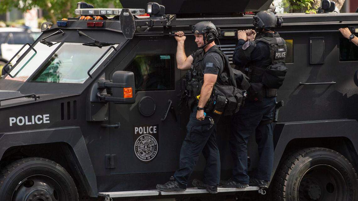 Sacramento police ride on a BearCat armored personnel carrier at the scene of a shooting scene on La Riviera Drive, Tuesday, July 16, 2019. The active shooter incident ended with no one hurt and the surrender of the shooter.
