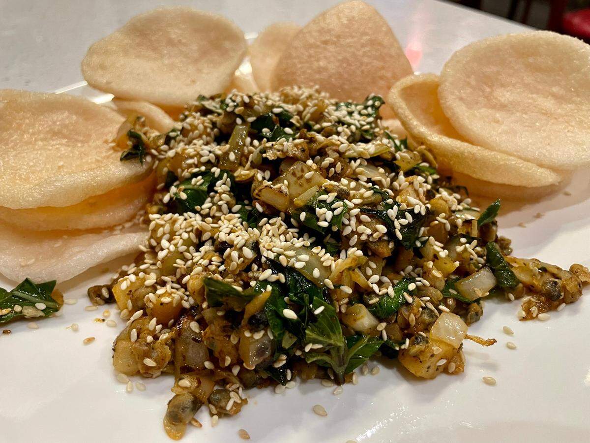 Pho Ru’s wok-tossed clams with shrimp chips ($11.80) are a simple and easy-to-like appetizer.