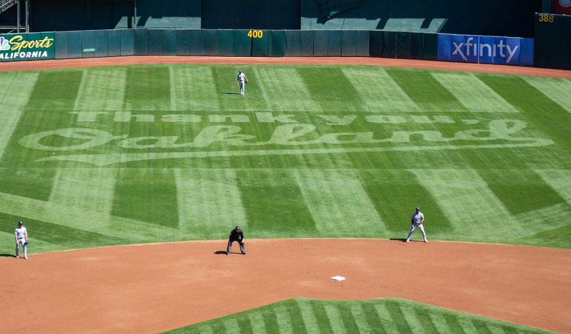 The centerfield grass is cut to thank the city of Oakland before the A’s final game at Oakland-Alameda County Coliseum on Thursday.