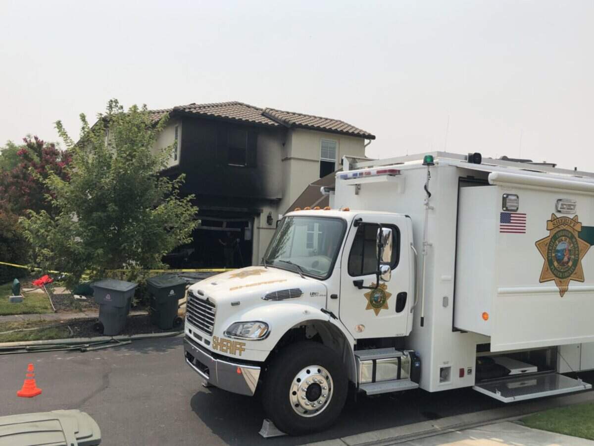 Placer County evidence technicians at the scene of the fatal Hazeltine Lane garage fire Tuesday.