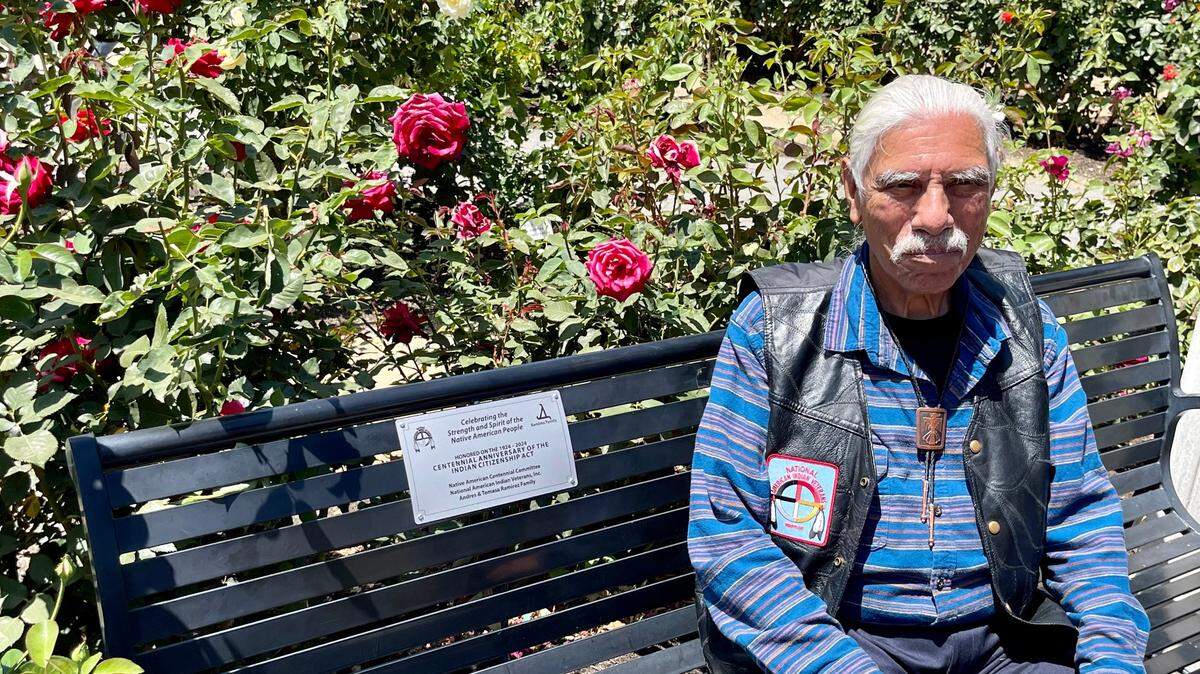 Frank Ramirez, national director of governmental affairs at the National American Indian Veterans Inc., commemorates the centennial anniversary of the Indian Citizenship Act of 1924 with a new bench plaque at the World Peace Rose Garden near the Capitol in Sacramento on Saturday.
