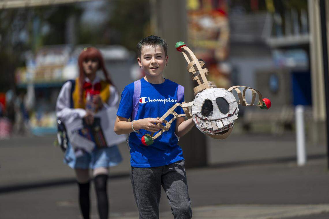 Vinicius Souva, 11, of Sacramento, carries a prop he made from the Poppy Playtime video game during SacAnime at Cal Expo on Friday, April 24, 2026.
