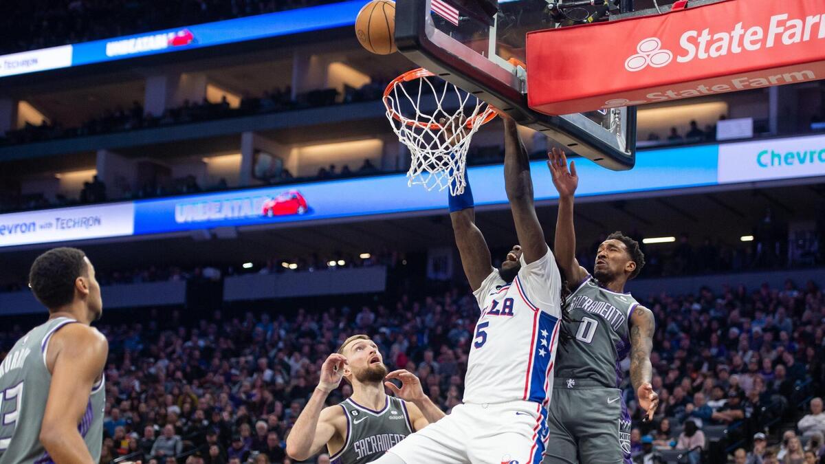Sacramento Kings guard Malik Monk (0) blocks Philadelphia 76ers center Montrezl Harrell (5) dunk during the second half in the NBA basketball game Saturday, Jan. 21, 2023, at the Golden 1 Center in Sacramento. The 76ers won 129-127.