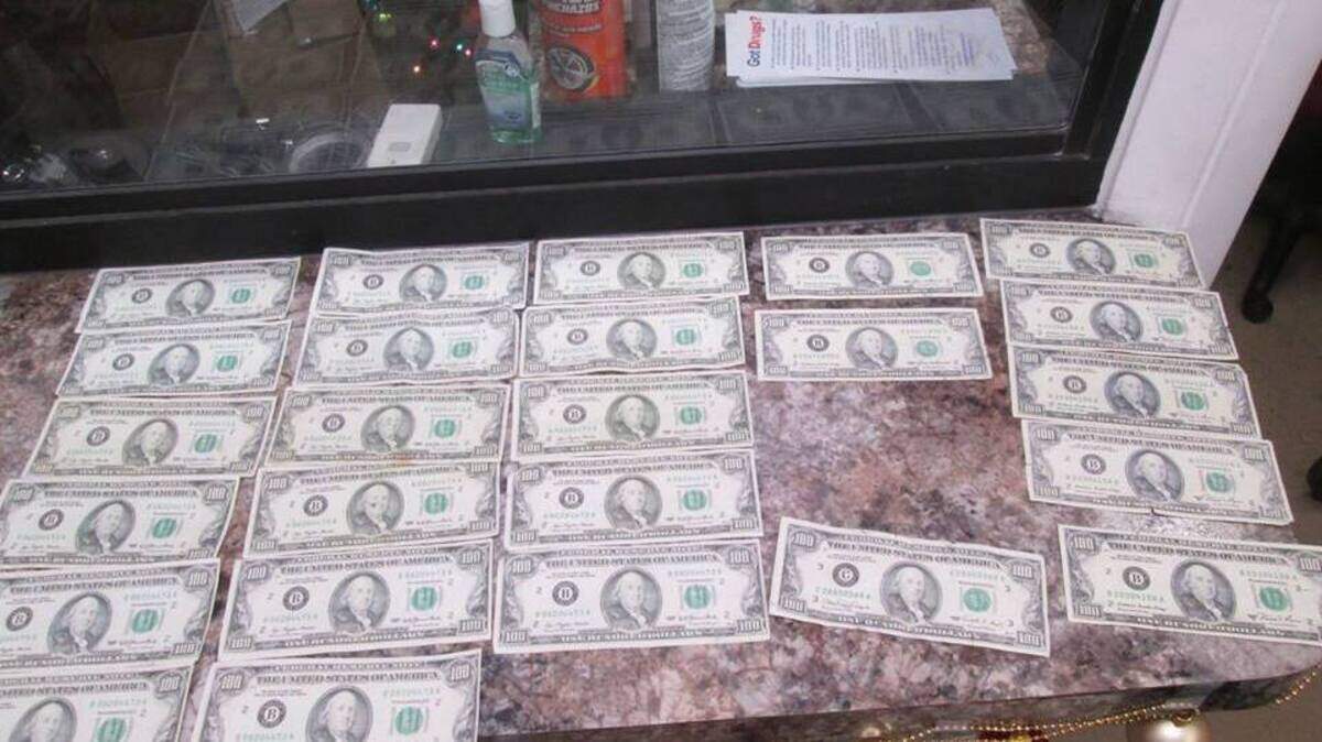 A Sunday, Dec. 23, 2018, photo released by Tuolumne County Sheriff’s Office shows counterfeit bills inside Baron Bower’s vehicle.