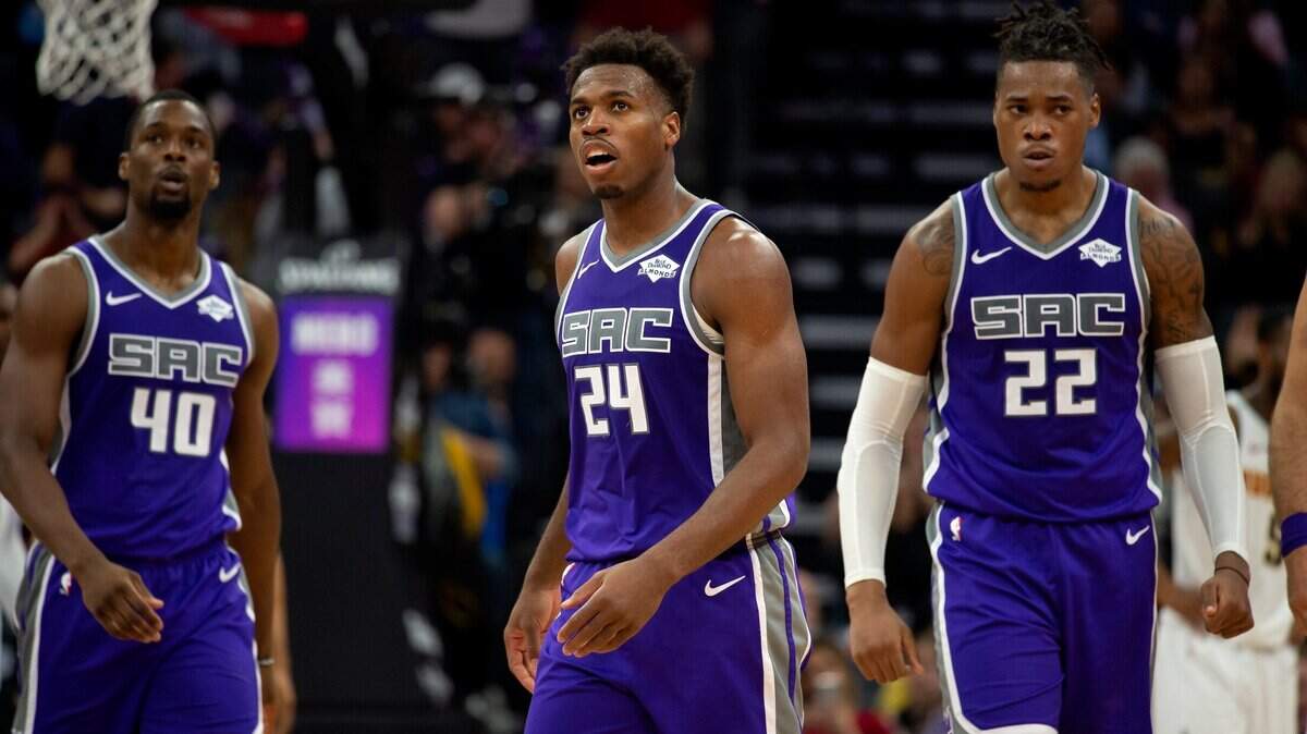 Sacramento Kings forward Harrison Barnes (40), Sacramento Kings guard Buddy Hield (24) and Sacramento Kings forward Richaun Holmes (22) walks to the bench during a game at Golden 1 Center on Monday, October 28, 2019 in Sacramento.