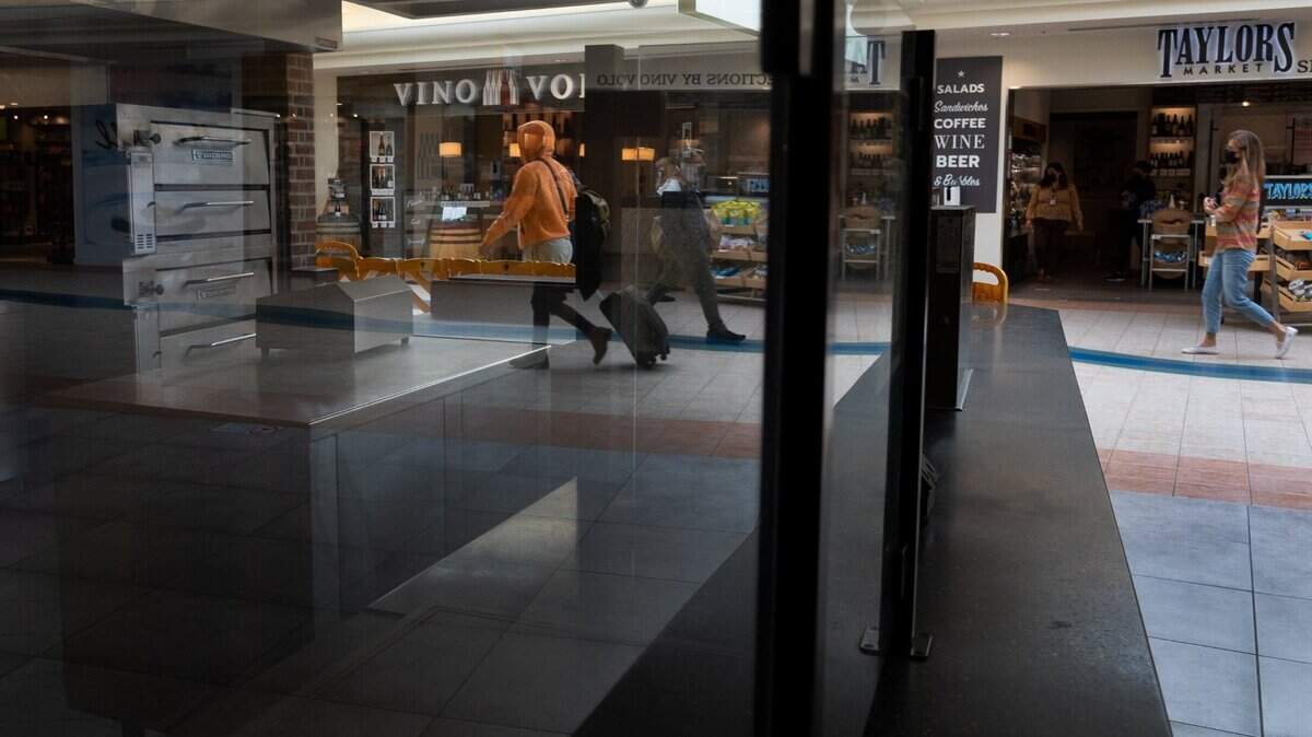 Passengers walk through Terminal A at the Sacramento International Airport on Tuesday, Oct. 26, 2021. Some flights have been delayed or canceled amid bad weather and a spike in COVID-19 cases.