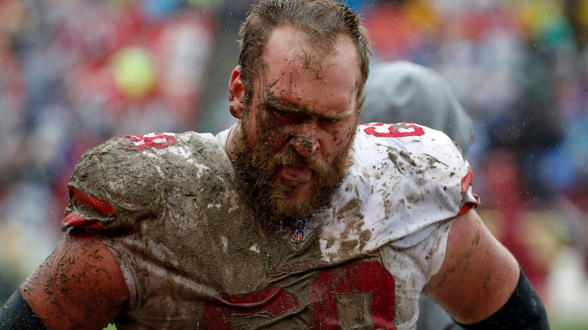 San Francisco offensive guard Mike Person walks on the sideline in the second half of the 49ers’ win over Washington.