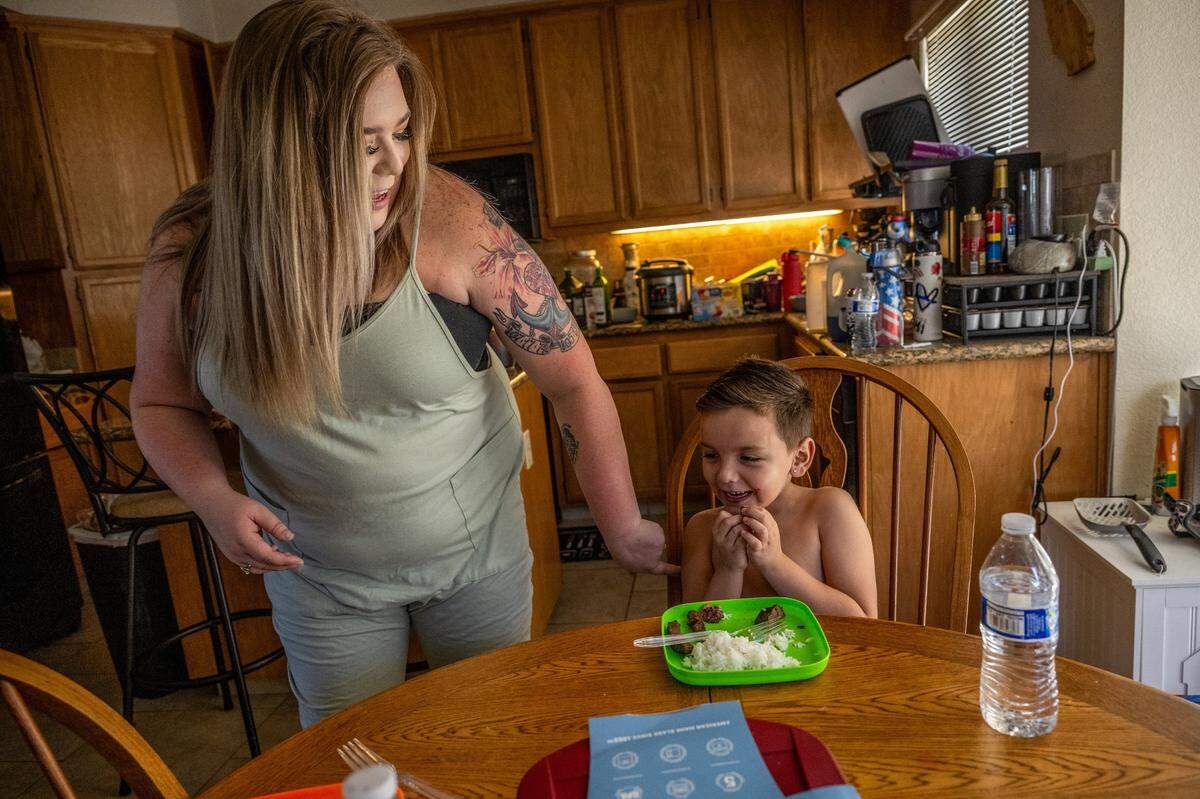Kaitlyn Weiss tickles her son Beau Weiss, 6, in their home in Modesto on Aug. 2. She said on the day he was born, she had gone to the hospital for medication for the contractions. “The next thing they were telling me, I had to have a repeat C-section, and so in that moment it’s hard to advocate for yourself,” said Weiss.