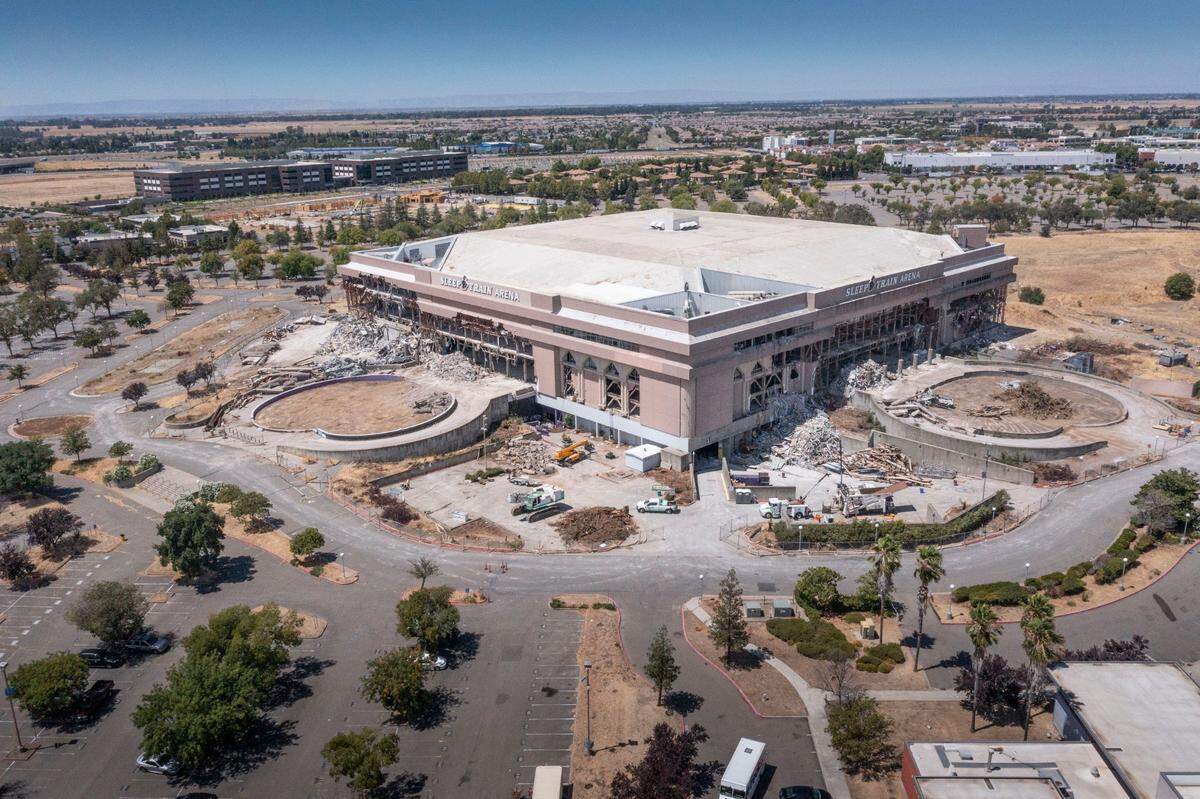 Demolition continues at Sleep Train Arena on Tuesday in Natomas. A new hospital will be built at the site in Sacramento and also include over 3,000 units of housing, as well as retail space, bike trails and an amphitheater.