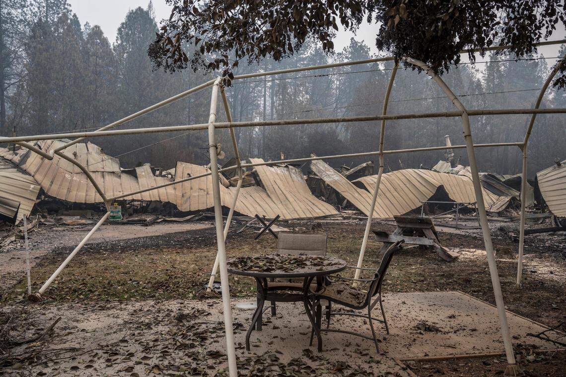 Lawn furniture outside a senior care facility remains from the deadly Camp Fire on Thursday Nov. 15, 2018 in Paradise, Calif.