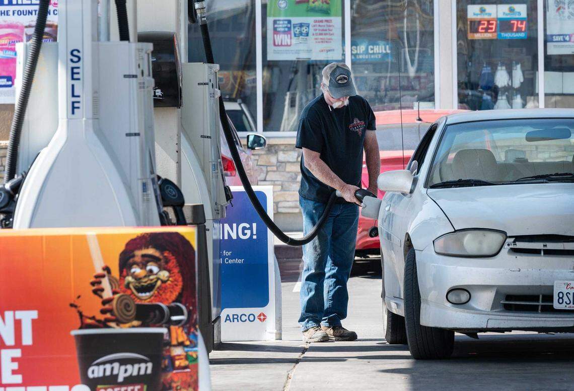A customer fills up with gas at the AM-PM Arco station on Crows Landing Road in Modesto in 2022.