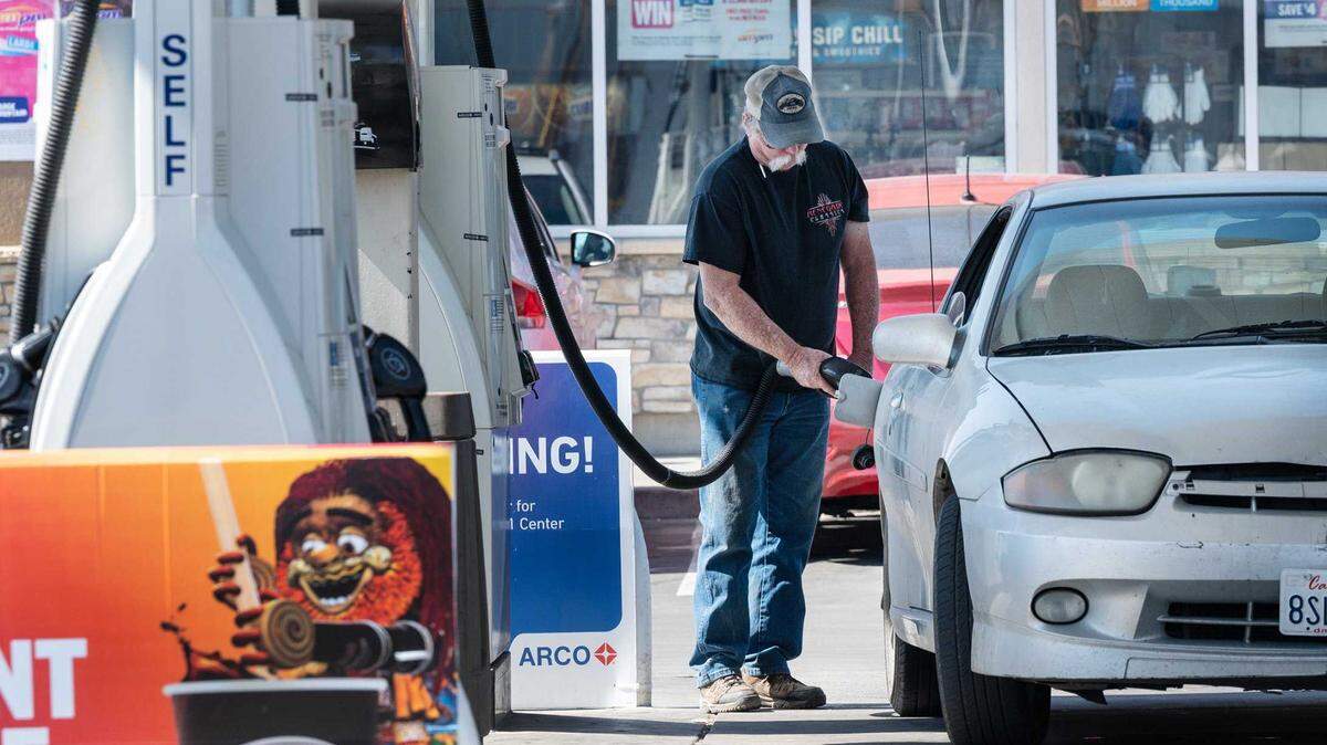 A customer fills up with gas at the AM-PM Arco station on Crows Landing Road in Modesto in 2022. 