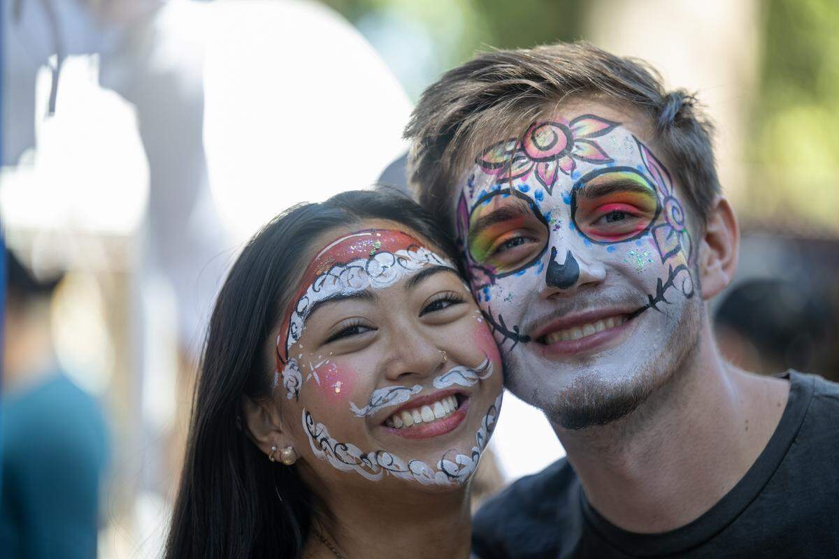Bridget Galia of Citrus Heights and Kaleb Crouse of Orangevale after having their faces painted at High Hill Farm in Apple Hill on Monday.