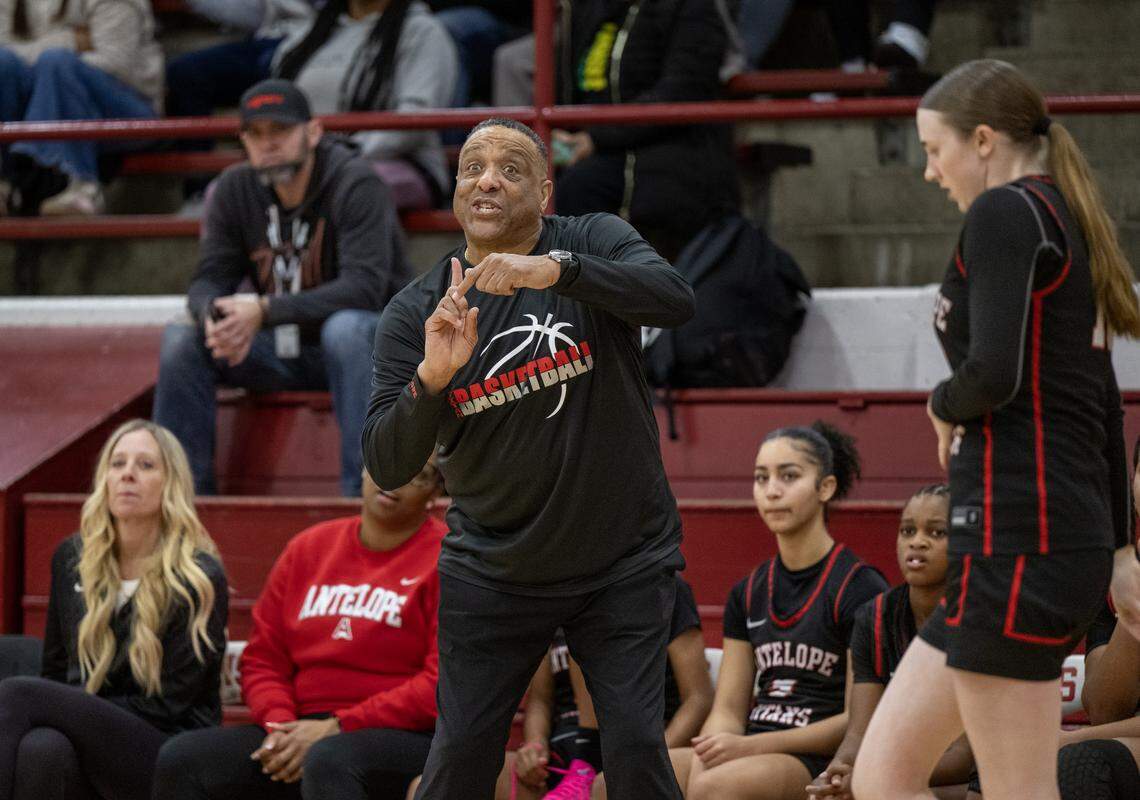 Antelope Titans coach Sean Chambers gives instruction to his players in the second half in a game against the McClatchy Lions in Sacramento on Friday, Jan. 9.
