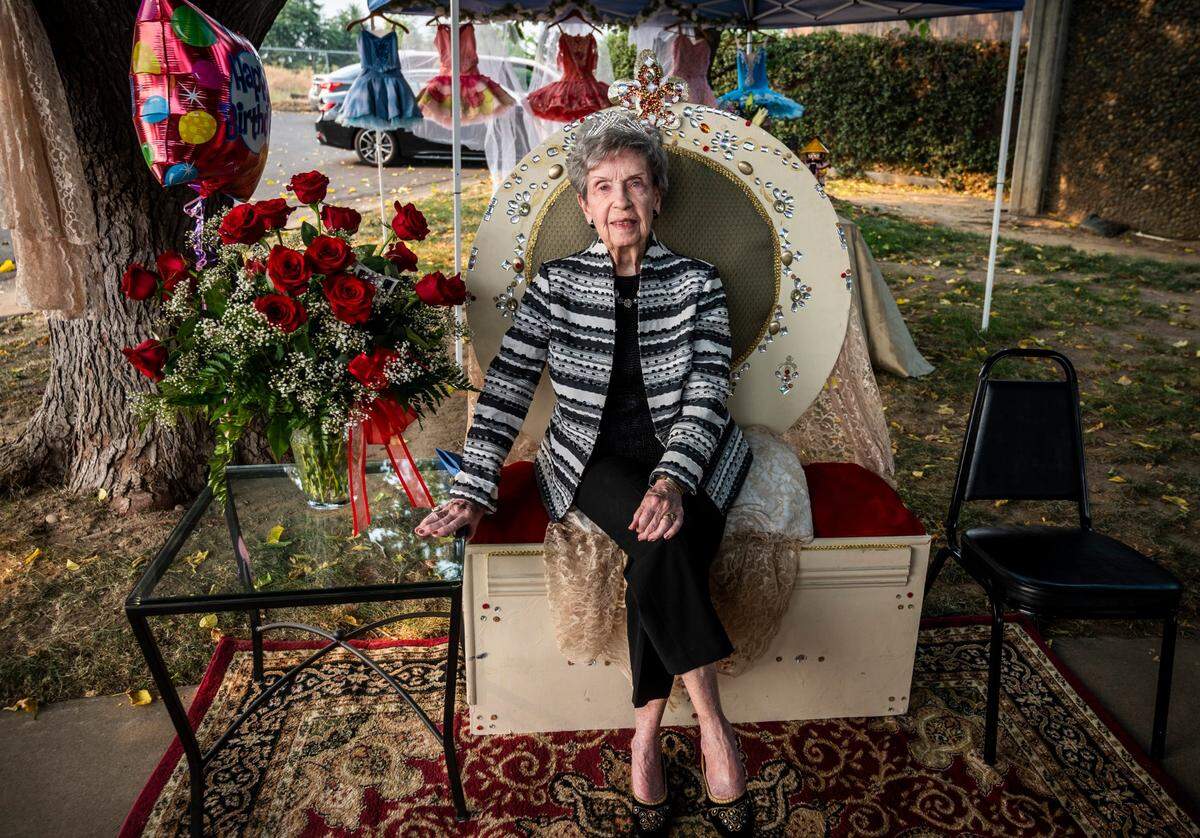 Barbara Crockett, co-founder of the Sacramento Ballet and a longtime ballet teacher in the Sacramento region, smiles as she sits on a throne at her 100th birthday party at Deane Dance school on in 2020. She turned 100 the day before. The event, socially distanced because of the coronavirus, included memories of Crockett shared via Zoom call, a drive-by parade and dances performed by students of the school.