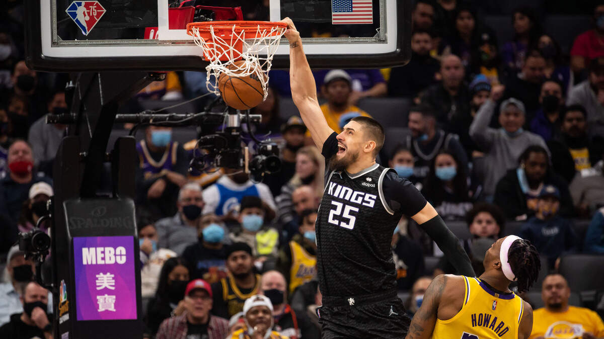 Sacramento Kings center Alex Len (25) dunks the ball over Los Angeles Lakers center Dwight Howard (39) during the fourth period of the NBA basketball game Wednesday, Jan. 12, 2022, at Golden 1 Center in Sacramento.