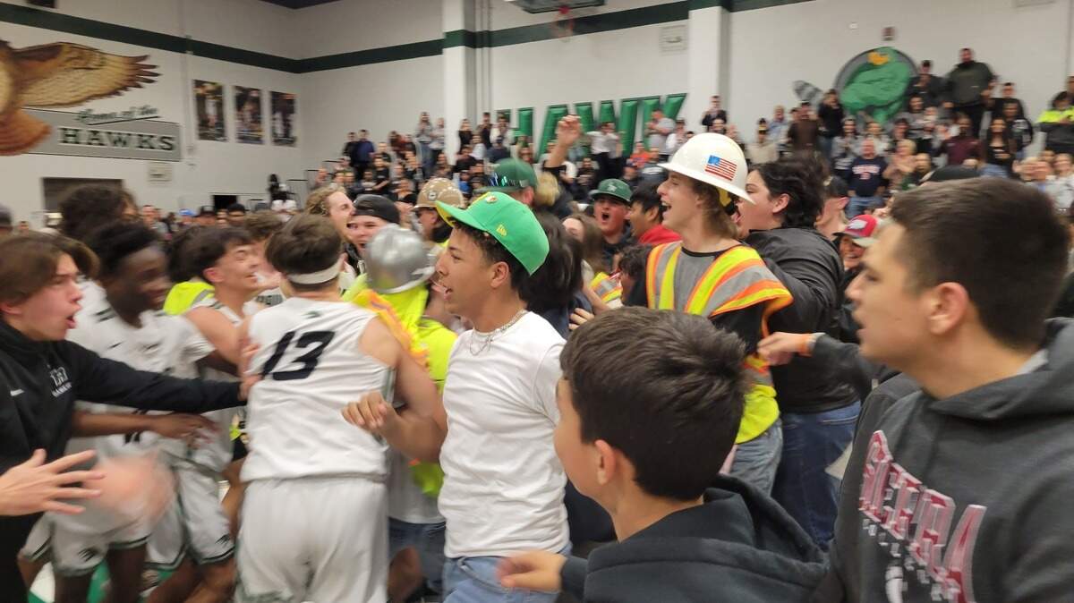 Liberty Ranch players and fans celebrate after a 60-58 win over Carlmont on Saturday night.