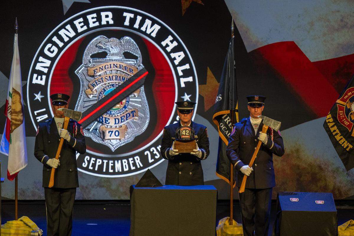 Members of the West Sacramento Fire Department participate in a Last Alarm ceremony at a memorial for fire engineer Tim Hall at Creekside Christian Church in Elk Grove on Tuesday.
