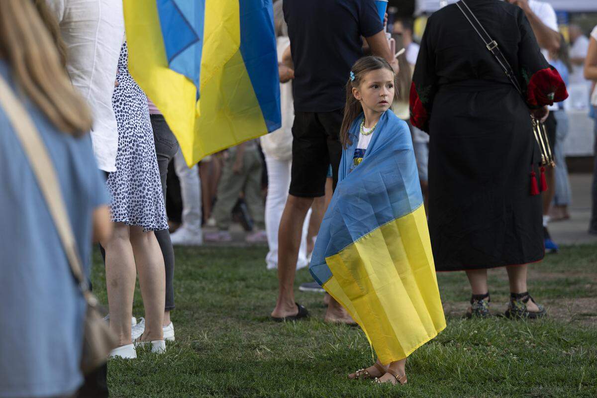 Ukrainian Americans wear Ukrainian flags during a Ukrainian Independence Day celebration at the California Capitol in Sacramento on Sunday.