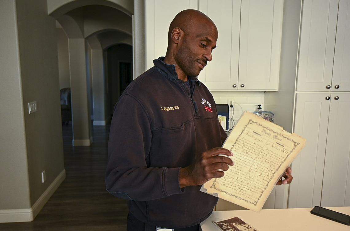 Jonathan Burgess looks at an autobiography that was written by his great-grandfather Rufus and became the inspiration for his children’s book “Gold Rush: Burgess Descendants” on earlier this month at his home in Sacramento County.