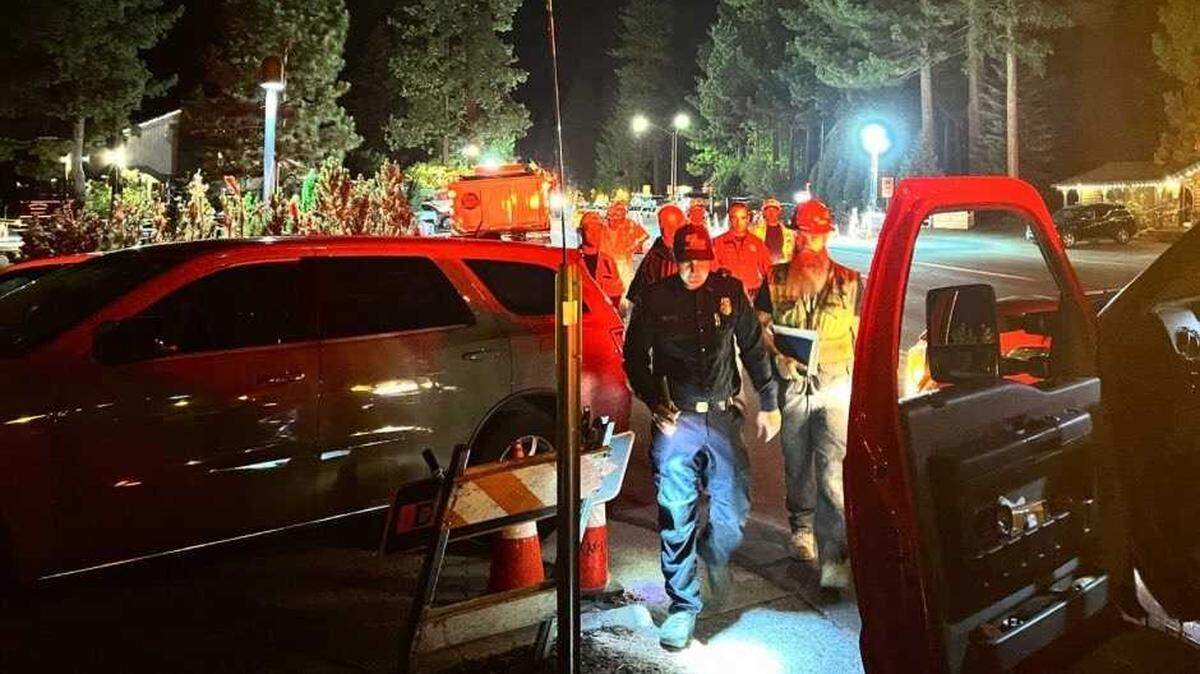 Crews work Thursday, July 19, 2024, after a sewer line was ruptured by a contractor along Highway 28 near Carnelian Bay in the Lake Tahoe area. One beach was closed for the day but North Tahoe Public Utility District officials say there was no threat to the public or the drinking water supply.