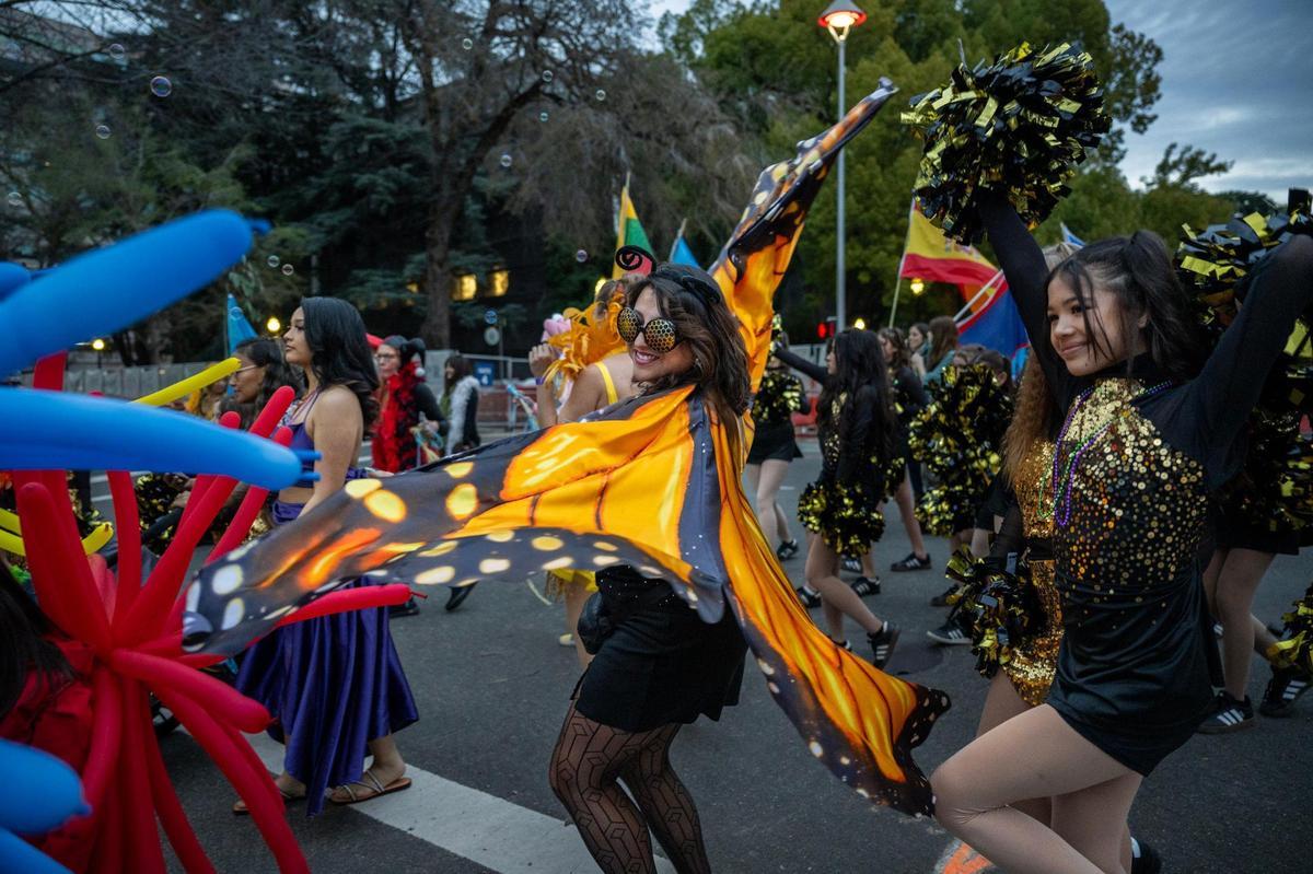 The Con-Nec-Tion Dance Project performs during the City of Trees Parade on Saturday.