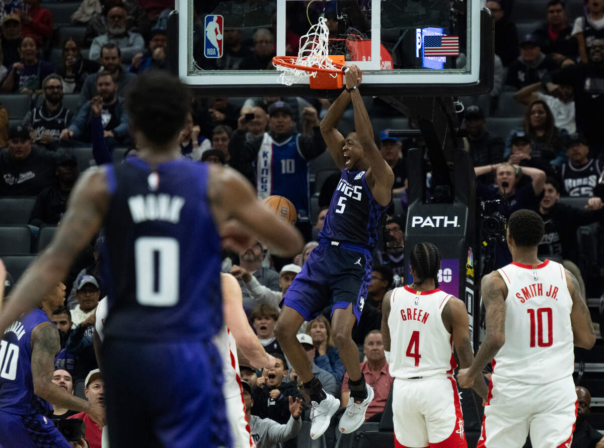 Sacramento Kings guard De’Aaron Fox (5) reacts after scoring a basket during an Emirates NBA Cup game at Golden 1 Center on Tuesday.