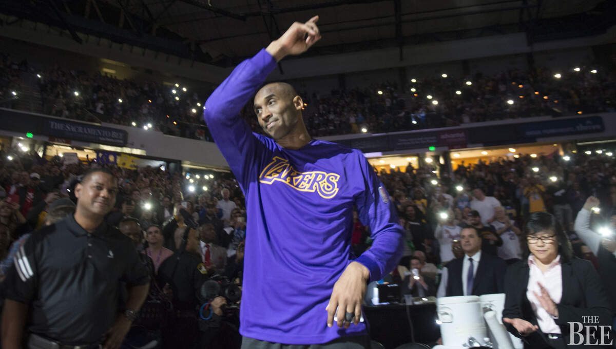 Los Angeles Lakers forward Kobe Bryant (24) stands up to acknowledge the fans.
