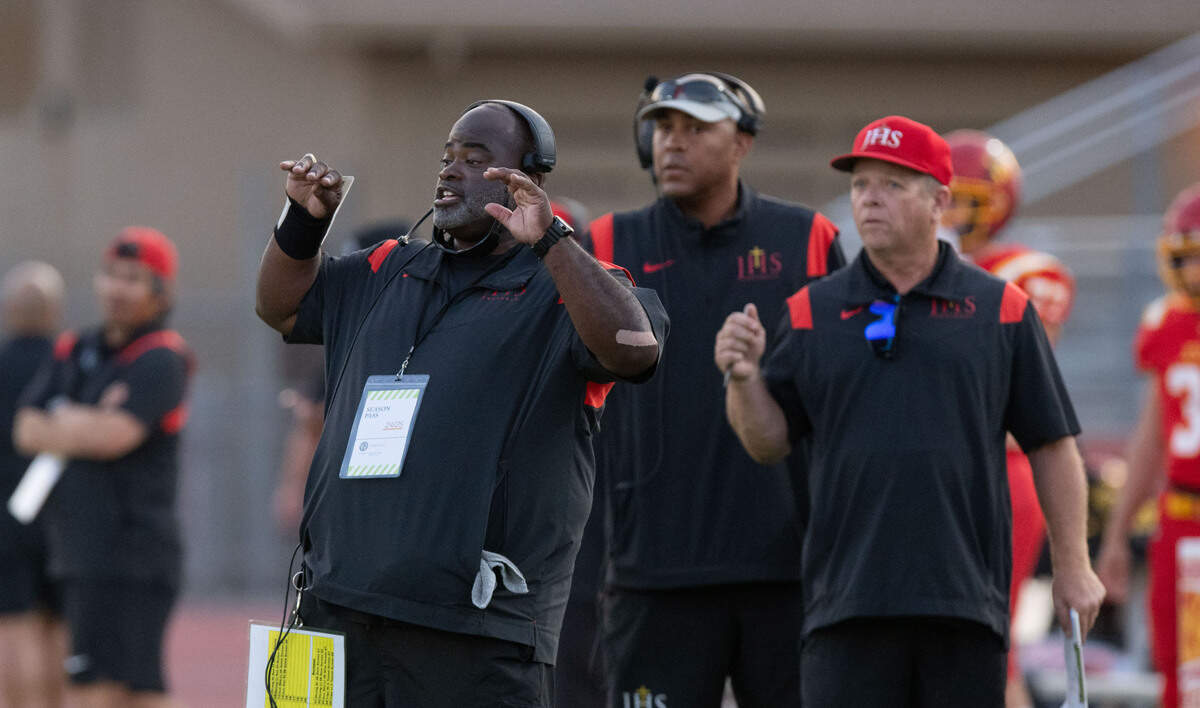 Jesuit coach Marlon Blanton communicates with his players during a timeout against Rio Americano in 2024.