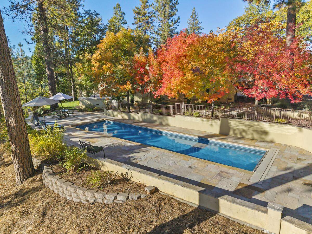 A pool, spa, bocce court and horseshoe pit offer endless fun and relaxation amid manicured grounds and towering trees.