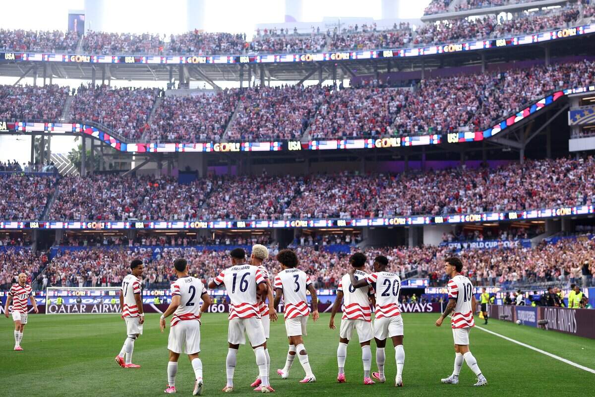 United States players celebrate their side's first goal, an own goal by Damian Bobadilla of Paraguay (not pictured), during the FIFA World Cup 2026 Group D match between the U.S. and Paraguay at Los Angeles Stadium on June 12 in Inglewood.