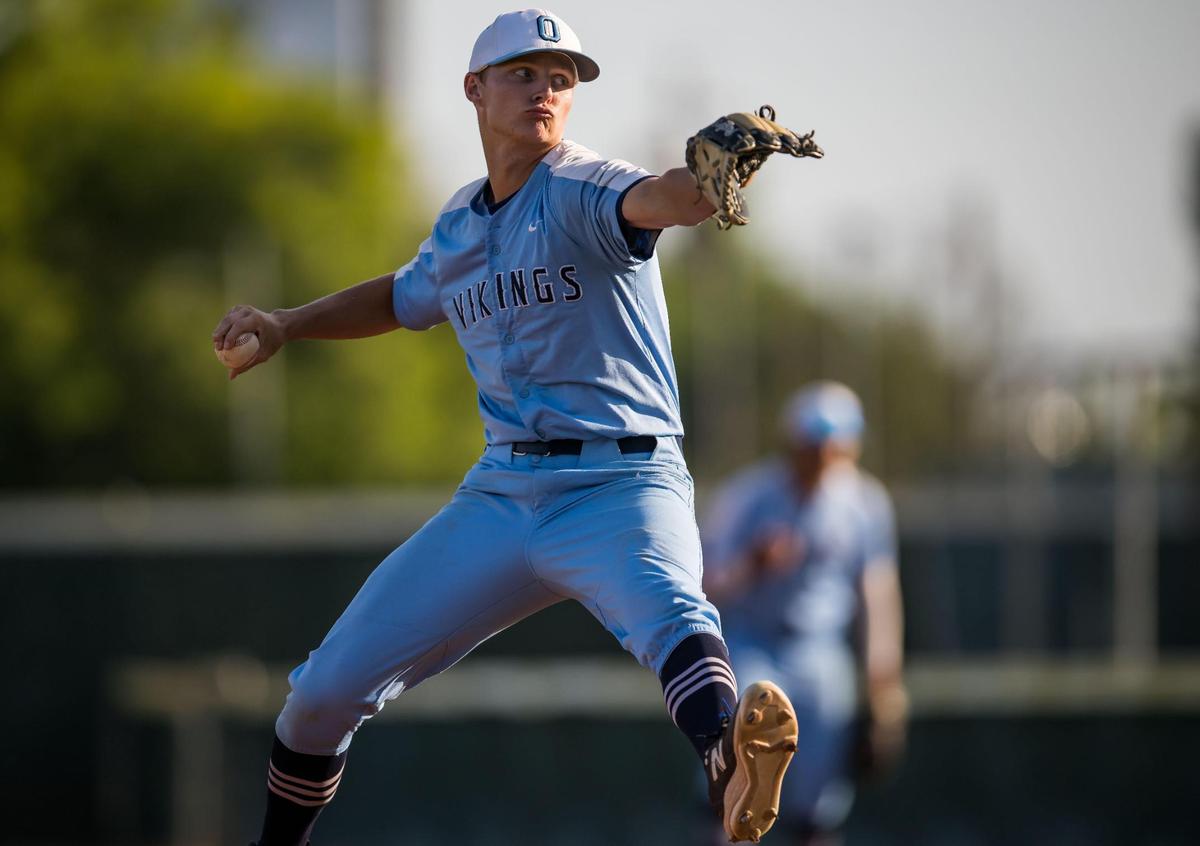 Oakmont Vikings winning pitcher Kurt Marton (2) throws against Woodland Wolves second baseman Gannon Cleaver (3) during the second inning at the CIF Sac-Joaquin Section Division IV high school baseball championship game Wednesday, May 24, 2023, at Sacramento City College.