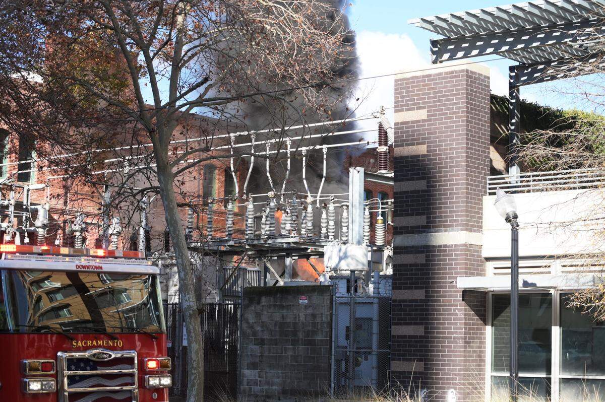 A fire burns at a power substation at 7th and H streets in downtown Sacramento on Tuesday, Dec. 14, 2021.