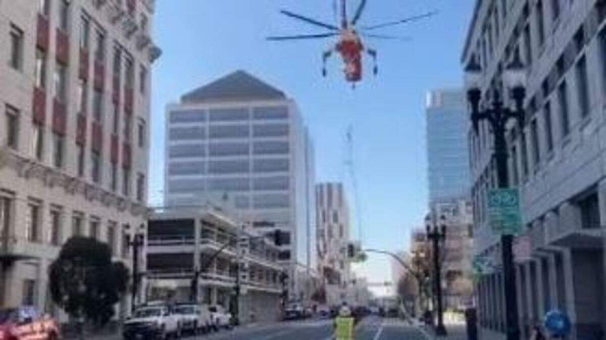 A huge air-conditioning unit crashed onto a downtown Oakland, California, street while being lifted by a cargo helicopter, video shows. No one was hurt.
