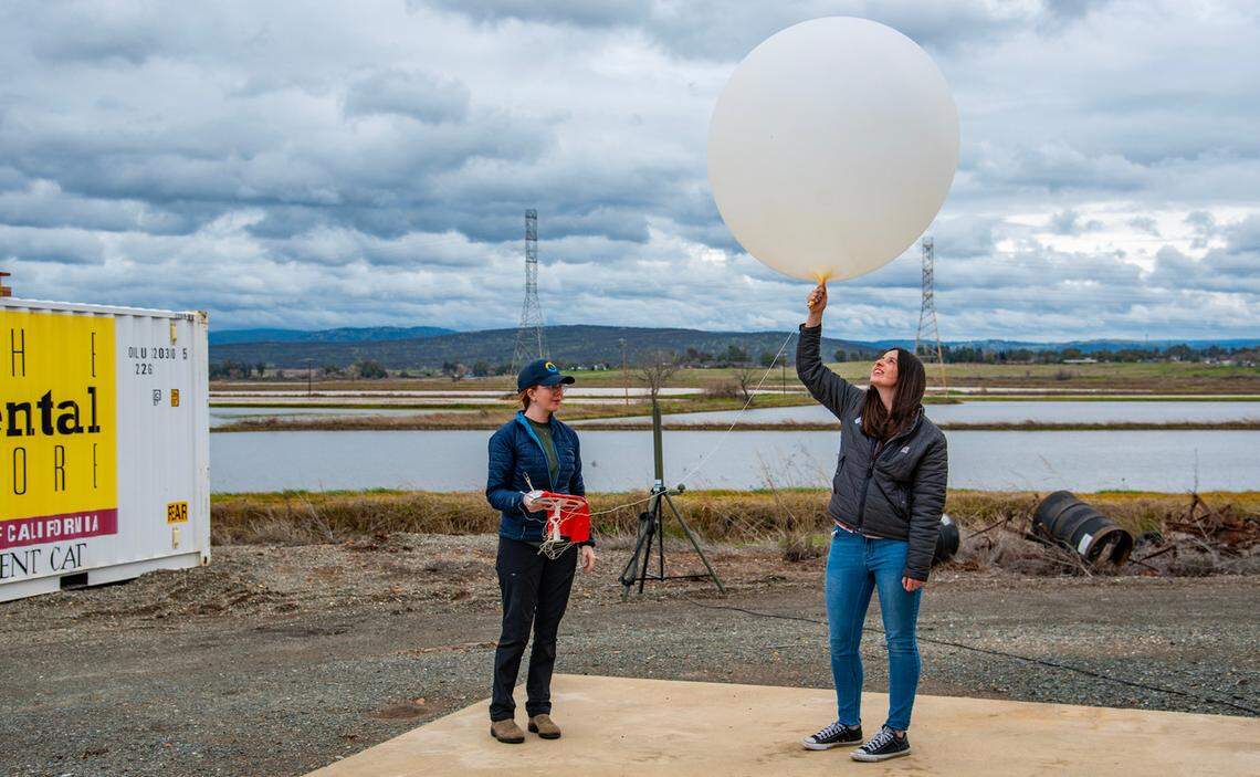 Weather researchers prepare to launch a radiosonde on a weather balloon into the sky Monday, Feb. 3, 2025, amid several waves of an atmospheric river that brought several inches of rain to the region last week.