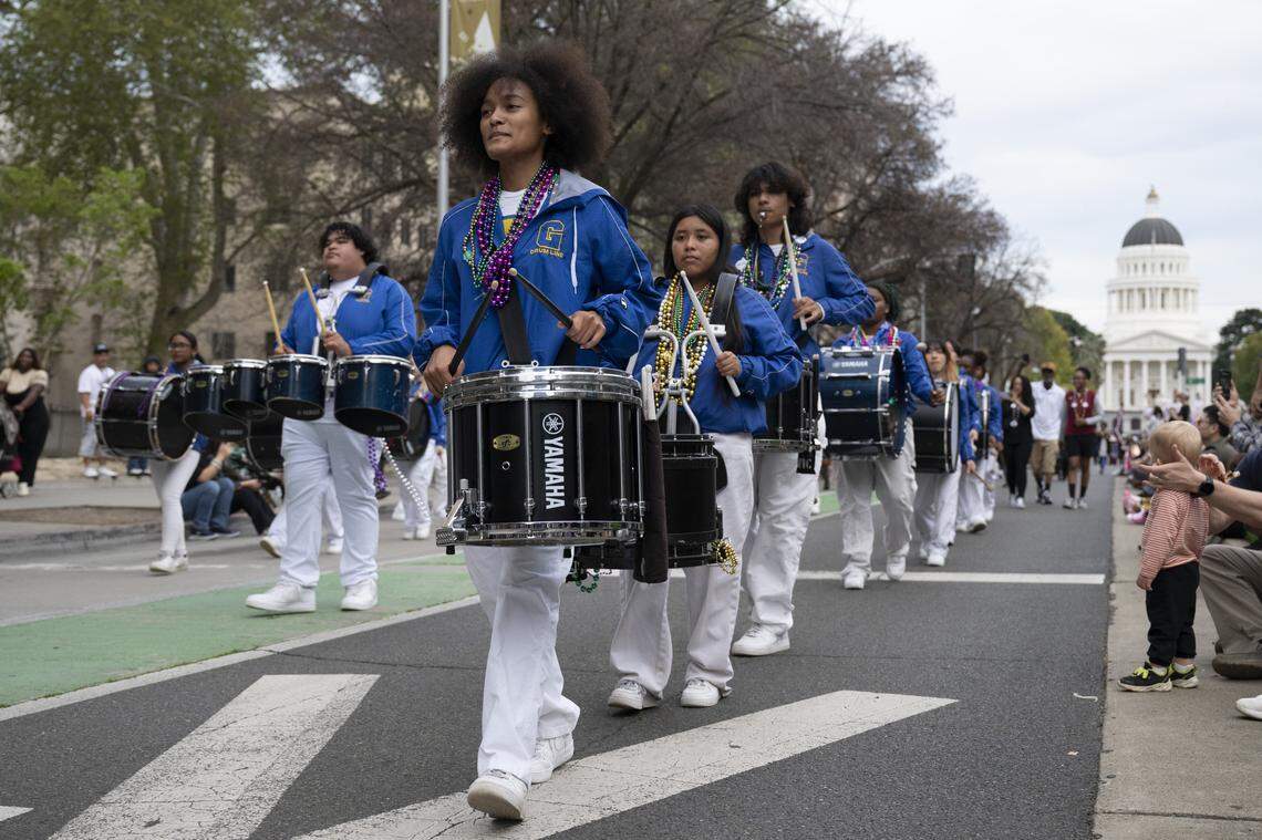 The Grant High Drumline marches down Capitol Mall during the City of Trees Parade in Sacramento on Saturday, Feb. 28, 2026.