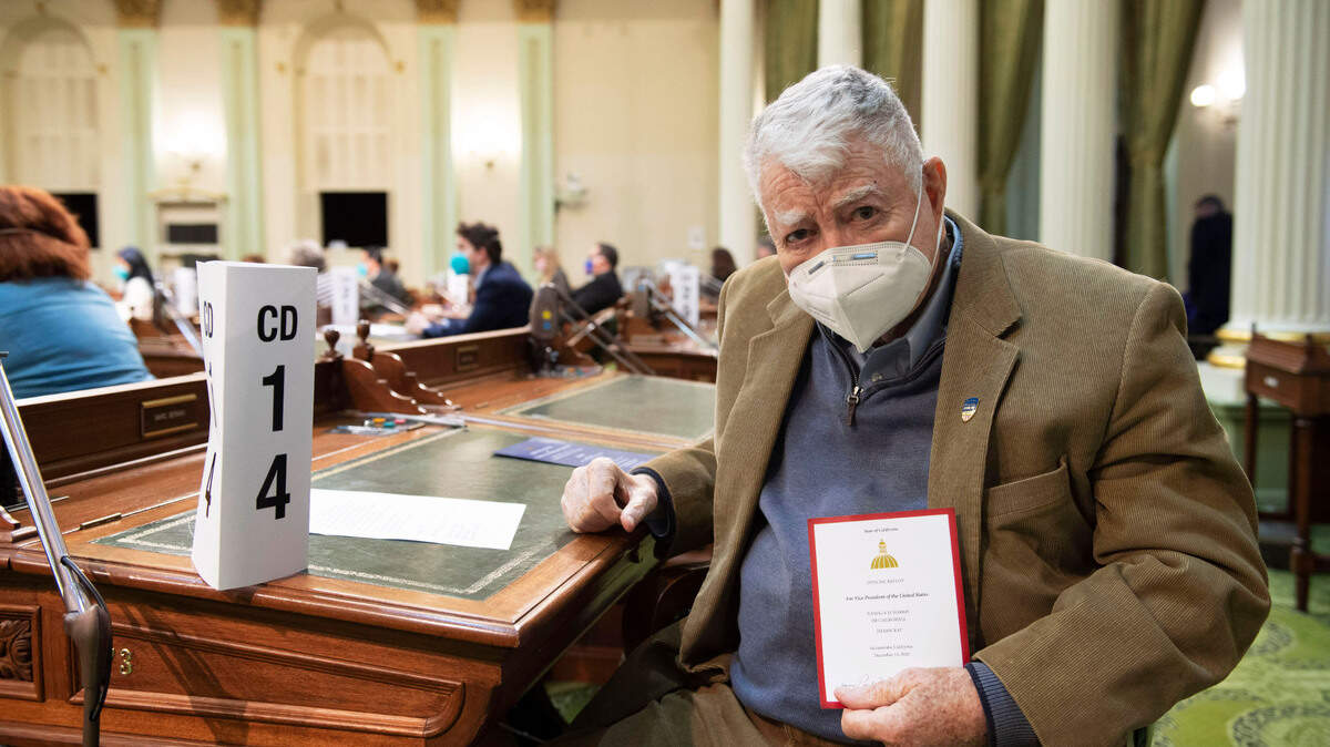 War hero and former Republican Congressman Pete McCloskey, a Winters resident, holds his Electoral College ballot at the California Capitol on Monday, Dec. 14, 2020. McCloskey, 93, was selected to be an elector by Bay Area Congresswoman Jackie Speier from the 14th Congressional District.