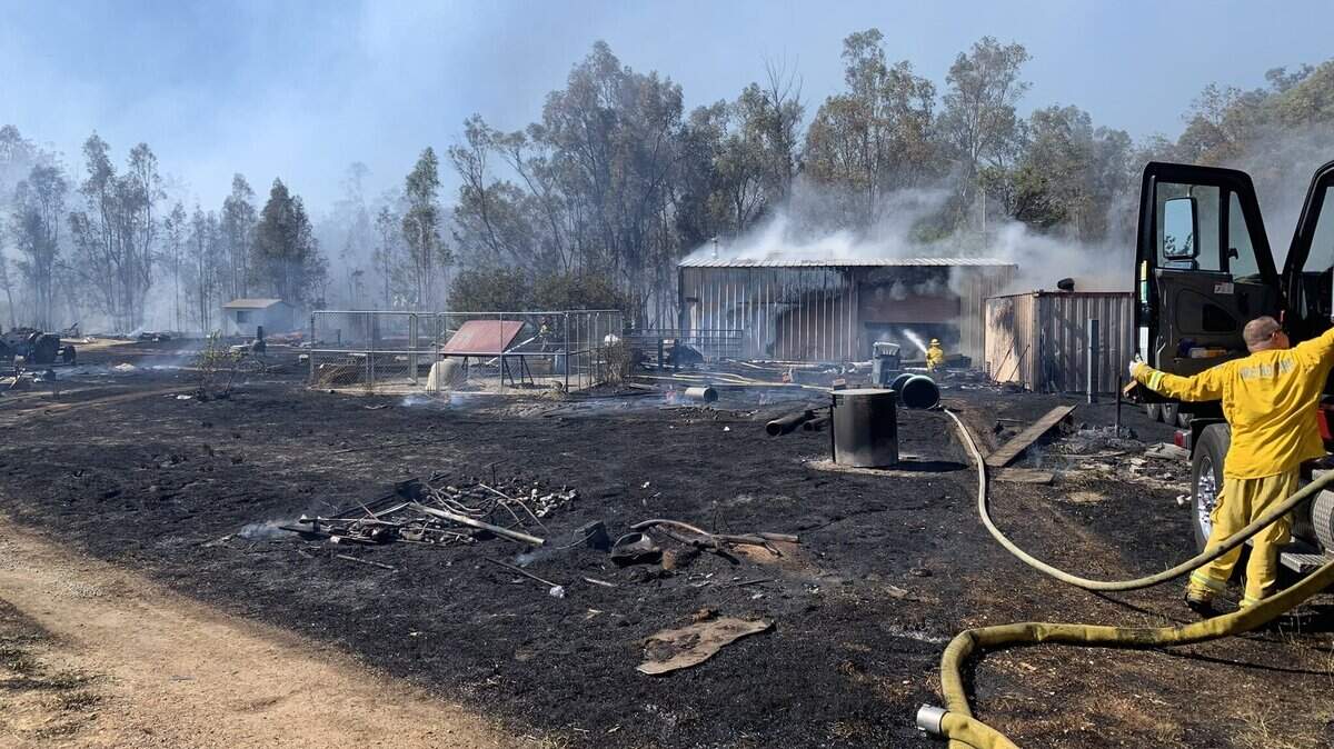 A fire estimated at 26 acres burned outbuildings and vegetation Monday afternoon, June 6, 2022, along Nelda Lane east of Herarld in Sacramento County, California.