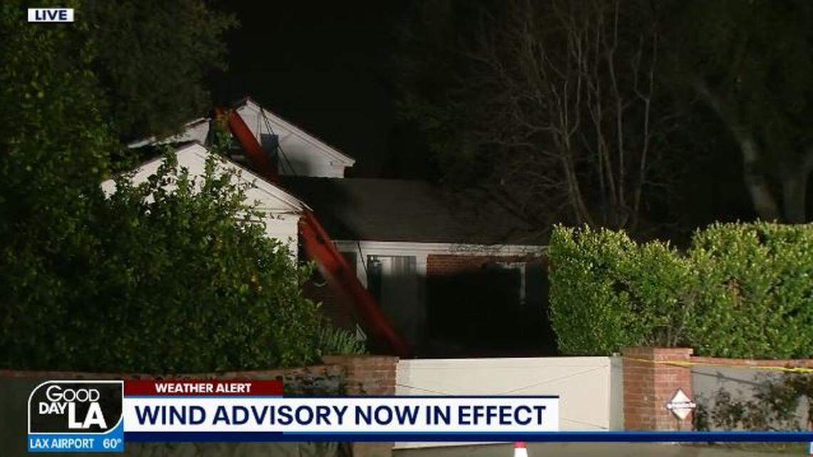 A crane being used at a filming location for a Netflix movie toppled onto a Pasadena, California, home Tueday nigth in high winds, firefighters say.